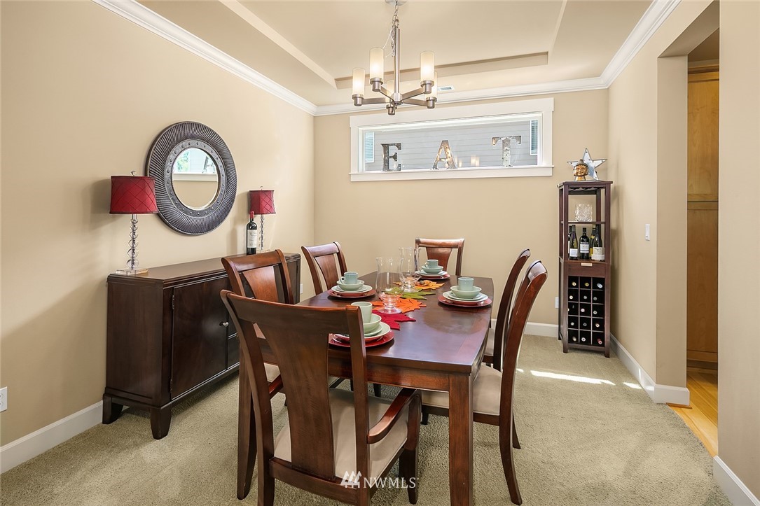 6308 Southeast 2nd Street Renton, WA 98059 - Photo 11 of 29 a view of a dining room with furniture and a chandelier