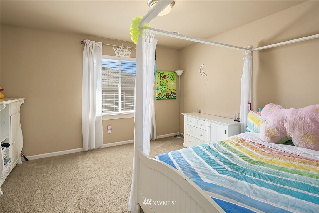 6308 Southeast 2nd Street Renton, WA 98059 - Photo 19 of 29 a bedroom with a bed and a window