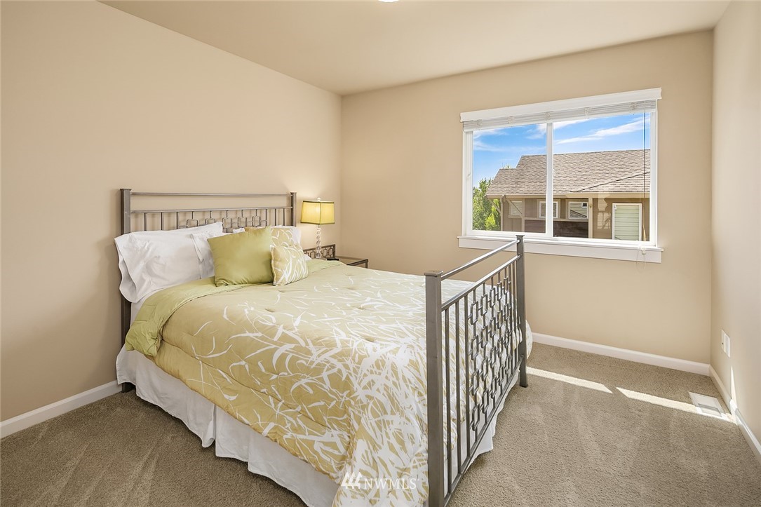 6308 Southeast 2nd Street Renton, WA 98059 - Photo 20 of 29 a bedroom with a bed and window