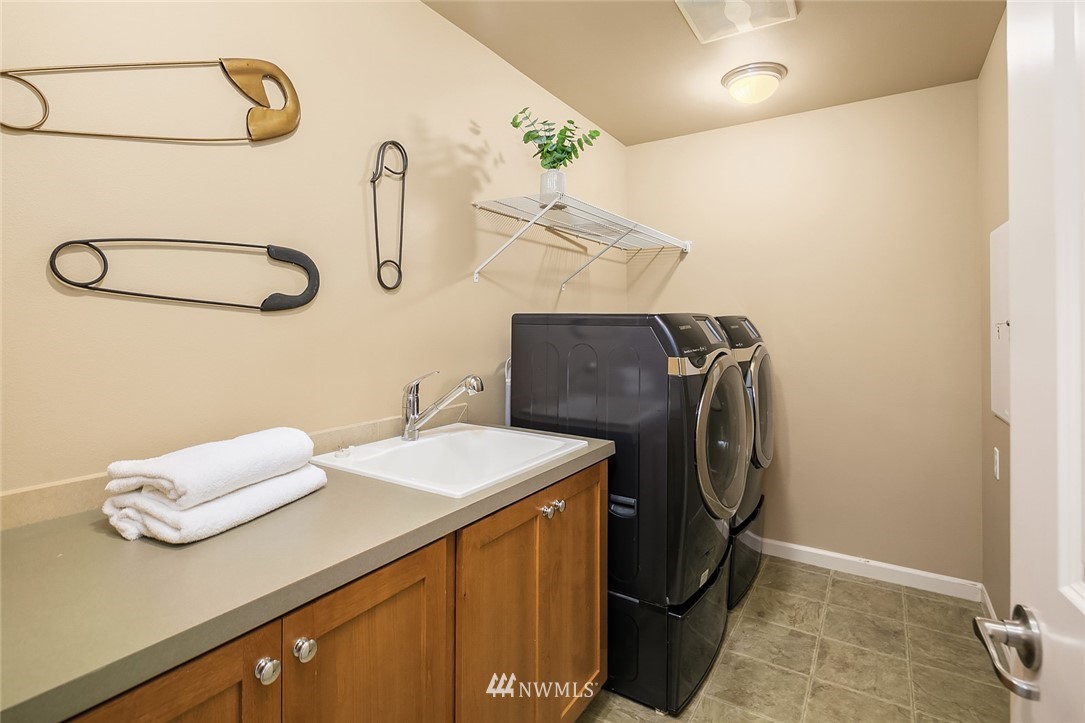 6308 Southeast 2nd Street Renton, WA 98059 - Photo 25 of 29 a bathroom with a sink and a mirror