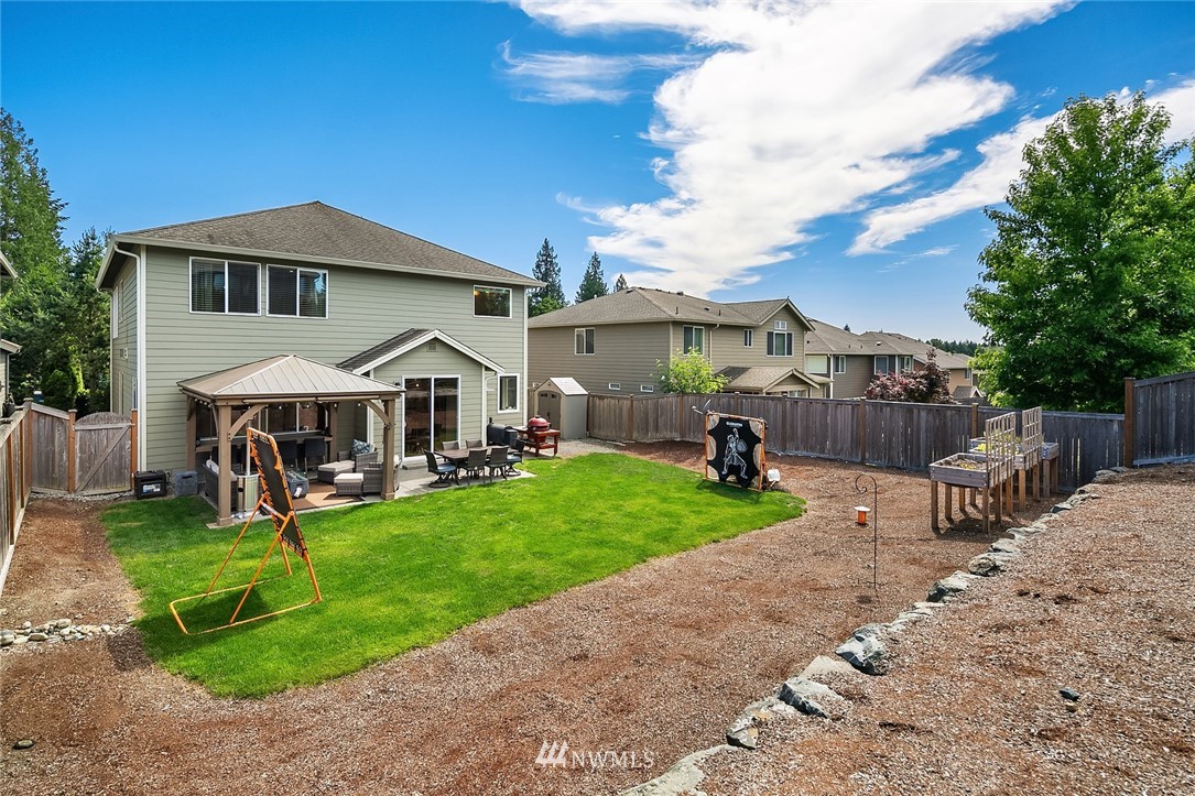 6308 Southeast 2nd Street Renton, WA 98059 - Photo 27 of 29 a view of a house with backyard porch and sitting area