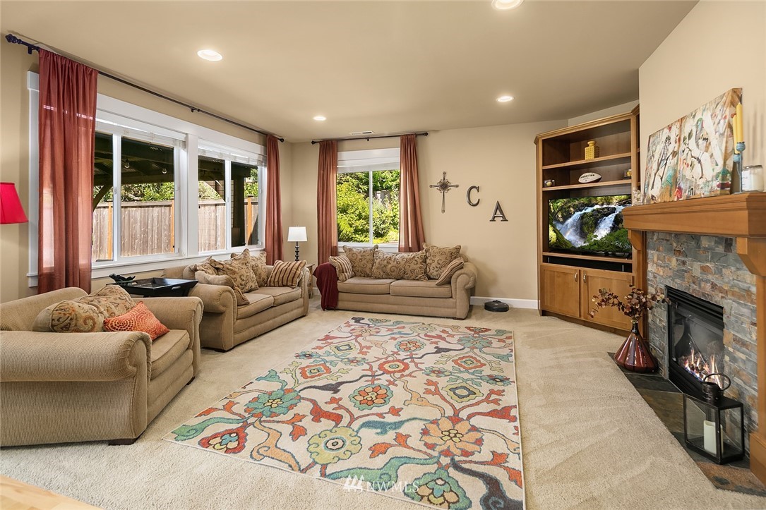 6308 Southeast 2nd Street Renton, WA 98059 - Photo 4 of 29 a living room with furniture fireplace and flat screen tv