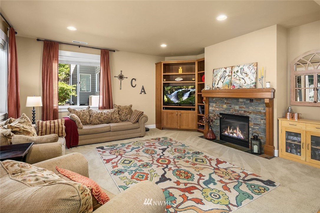 6308 Southeast 2nd Street Renton, WA 98059 - Photo 5 of 29 a living room with furniture and a fireplace