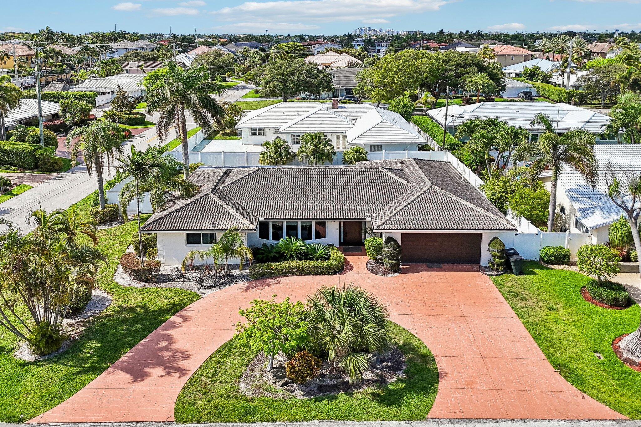 2940 Northeast 39th Court Lighthouse Point, FL 33064 - Photo 2 of 42 an aerial view of a house with yard patio and green space