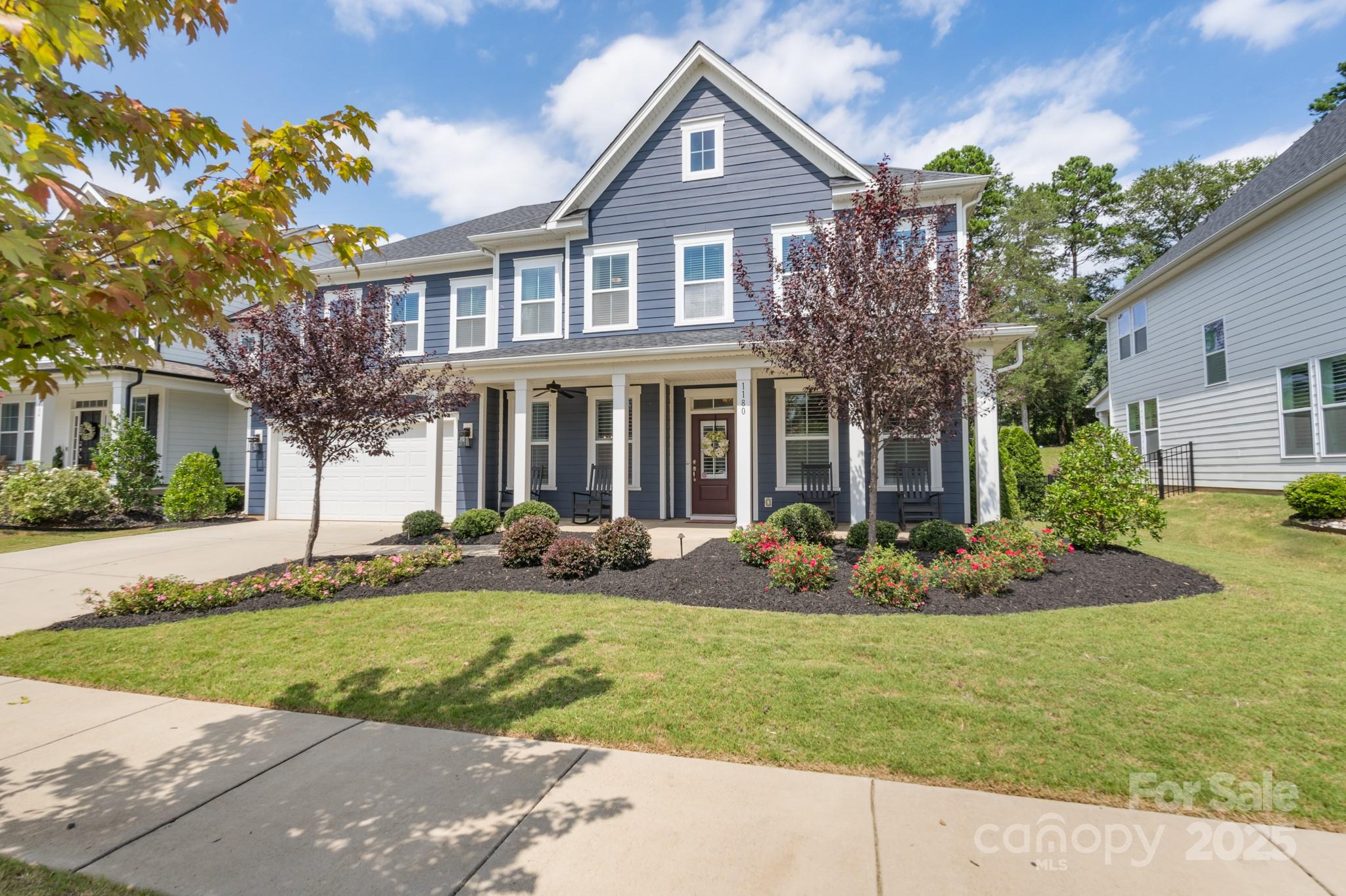 1180 Weir Court Fort Mill, SC 29708 - Photo 1 of 37 a front view of a house with garden and porch