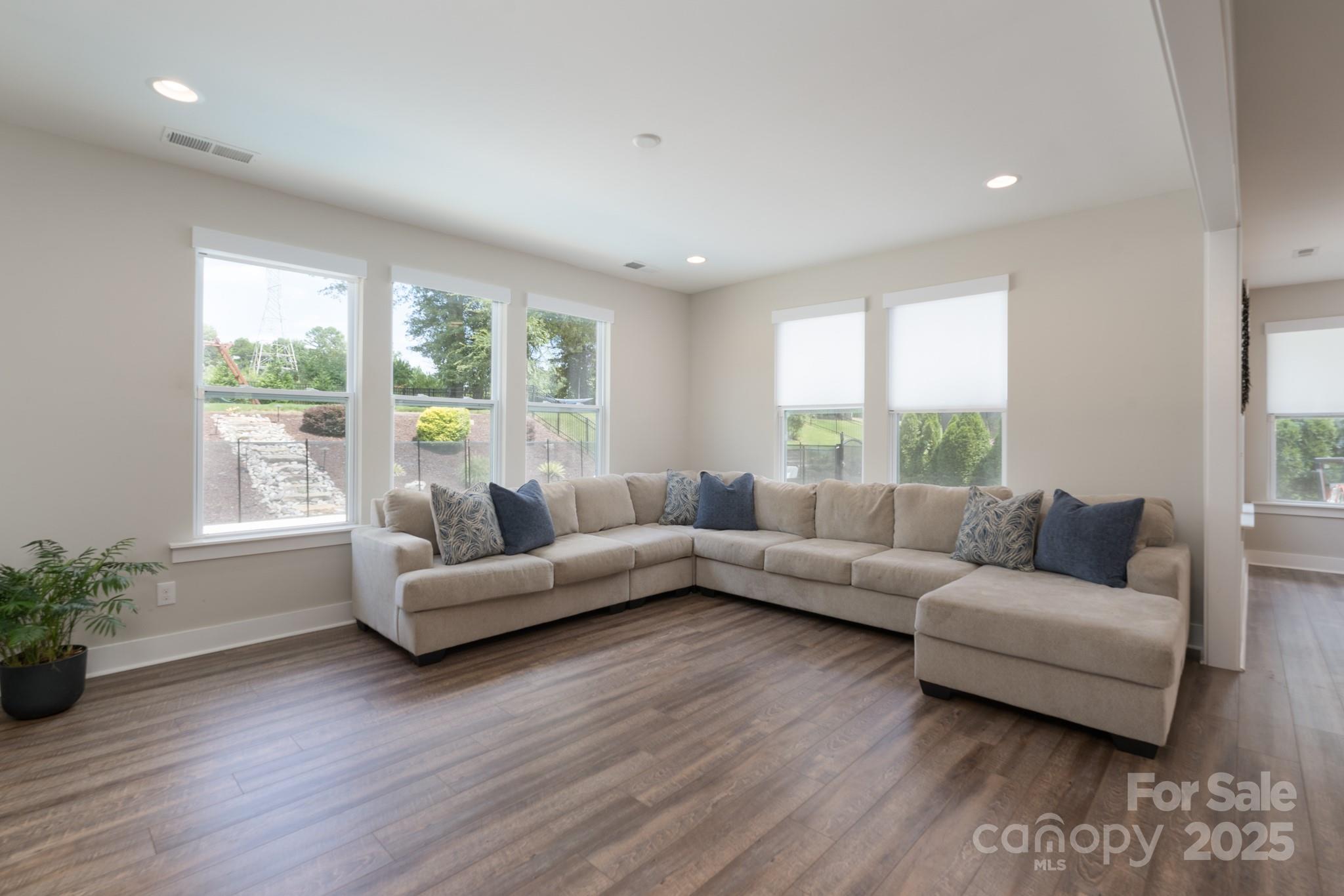 1180 Weir Court Fort Mill, SC 29708 - Photo 15 of 37 a living room with furniture and a large window