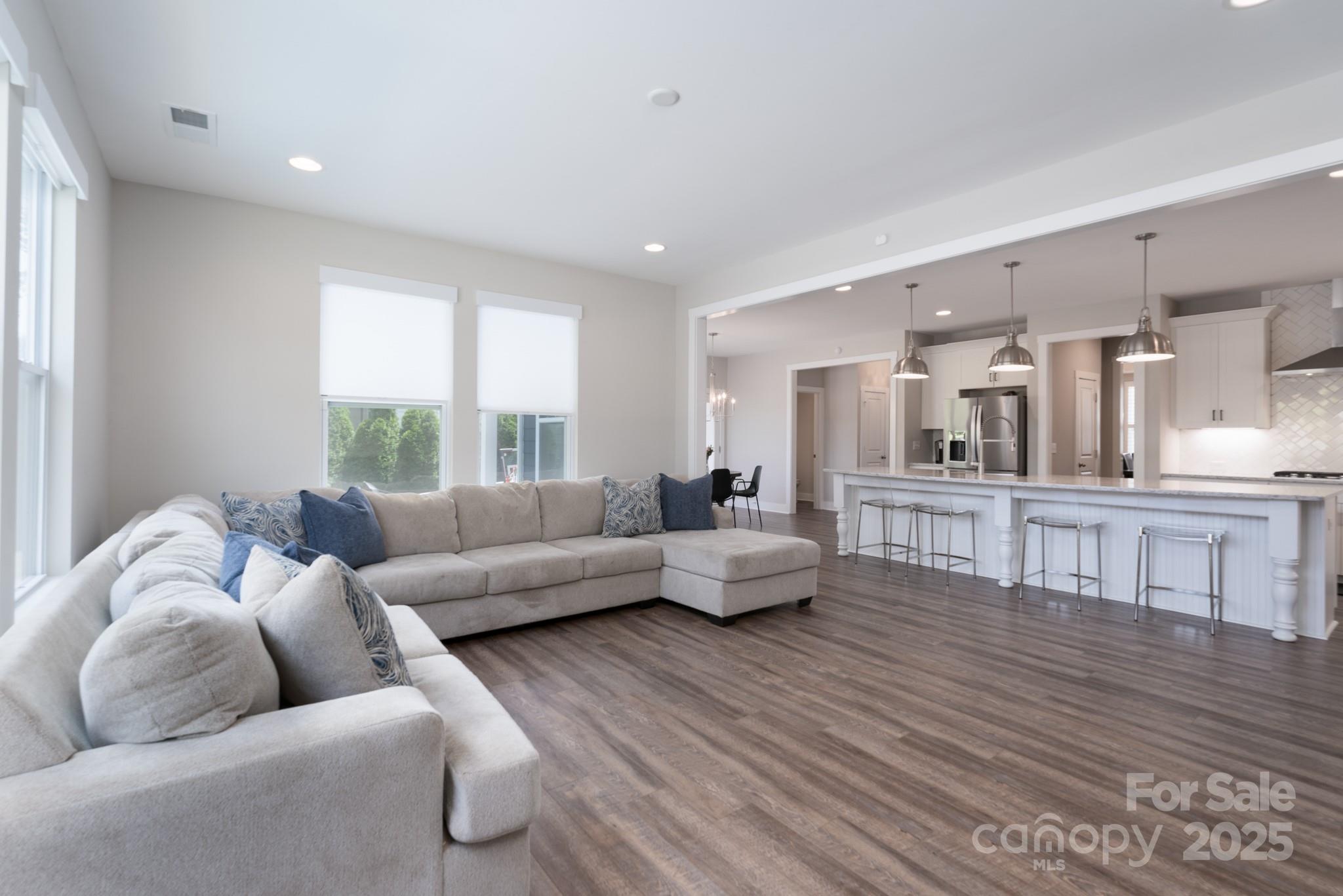 1180 Weir Court Fort Mill, SC 29708 - Photo 16 of 37 a living room with furniture and a large window