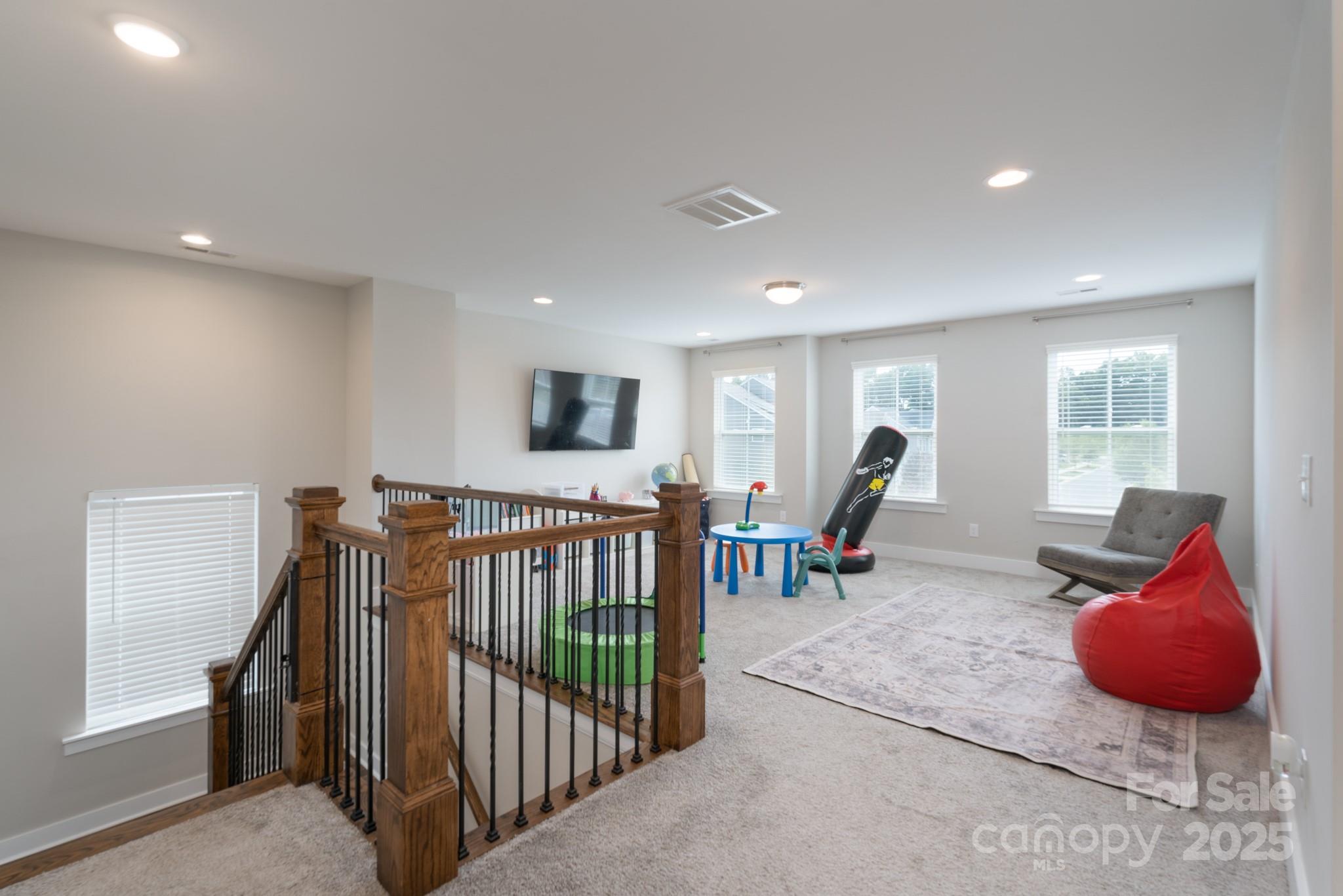 1180 Weir Court Fort Mill, SC 29708 - Photo 21 of 37 a living room with furniture and large windows