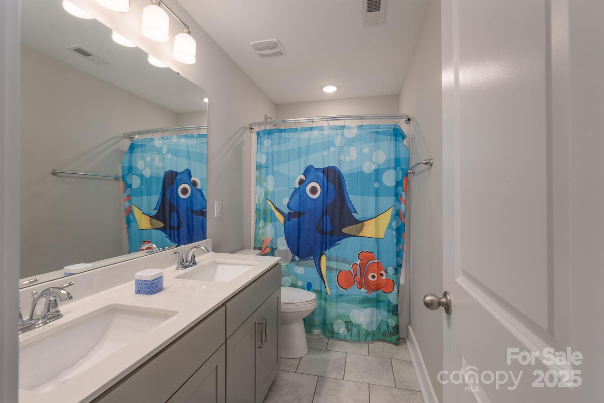 1180 Weir Court Fort Mill, SC 29708 - Photo 26 of 37 a bathroom with a sink mirror and vanity