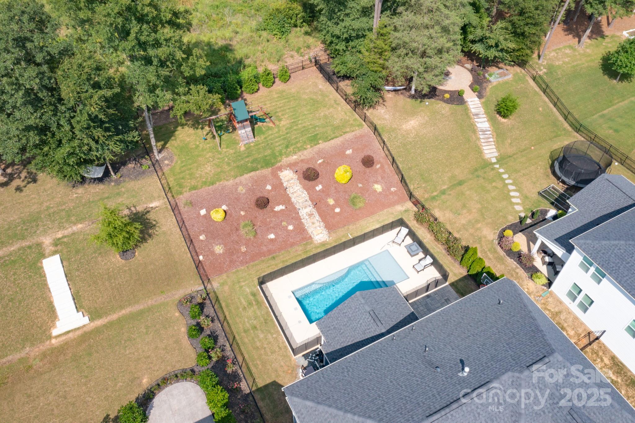 1180 Weir Court Fort Mill, SC 29708 - Photo 30 of 37 an aerial view of a house a yard and a fire pit