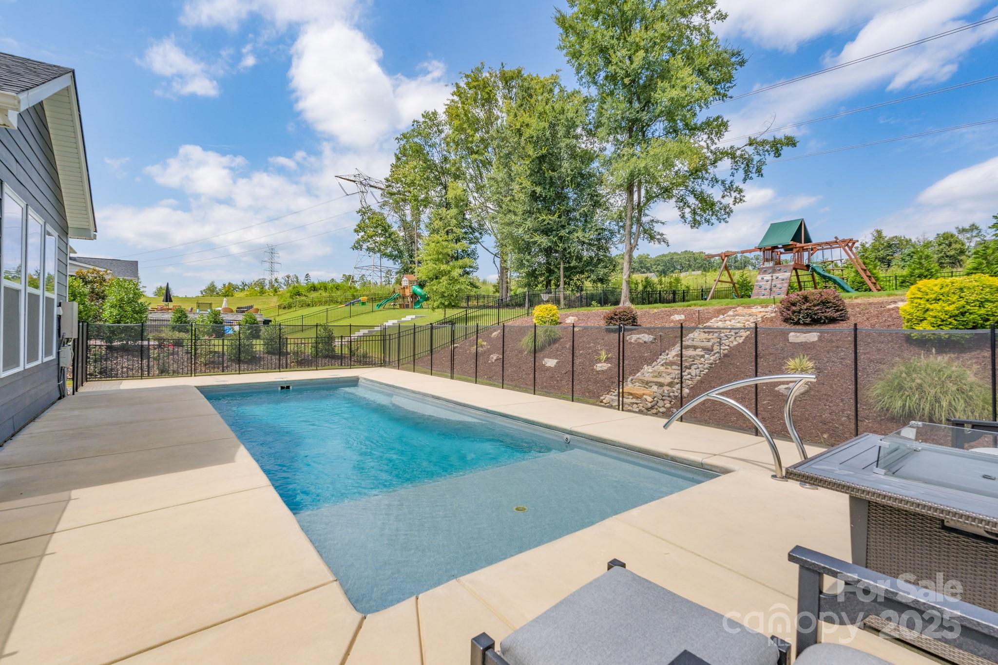 1180 Weir Court Fort Mill, SC 29708 - Photo 32 of 37 a view of a swimming pool with a patio