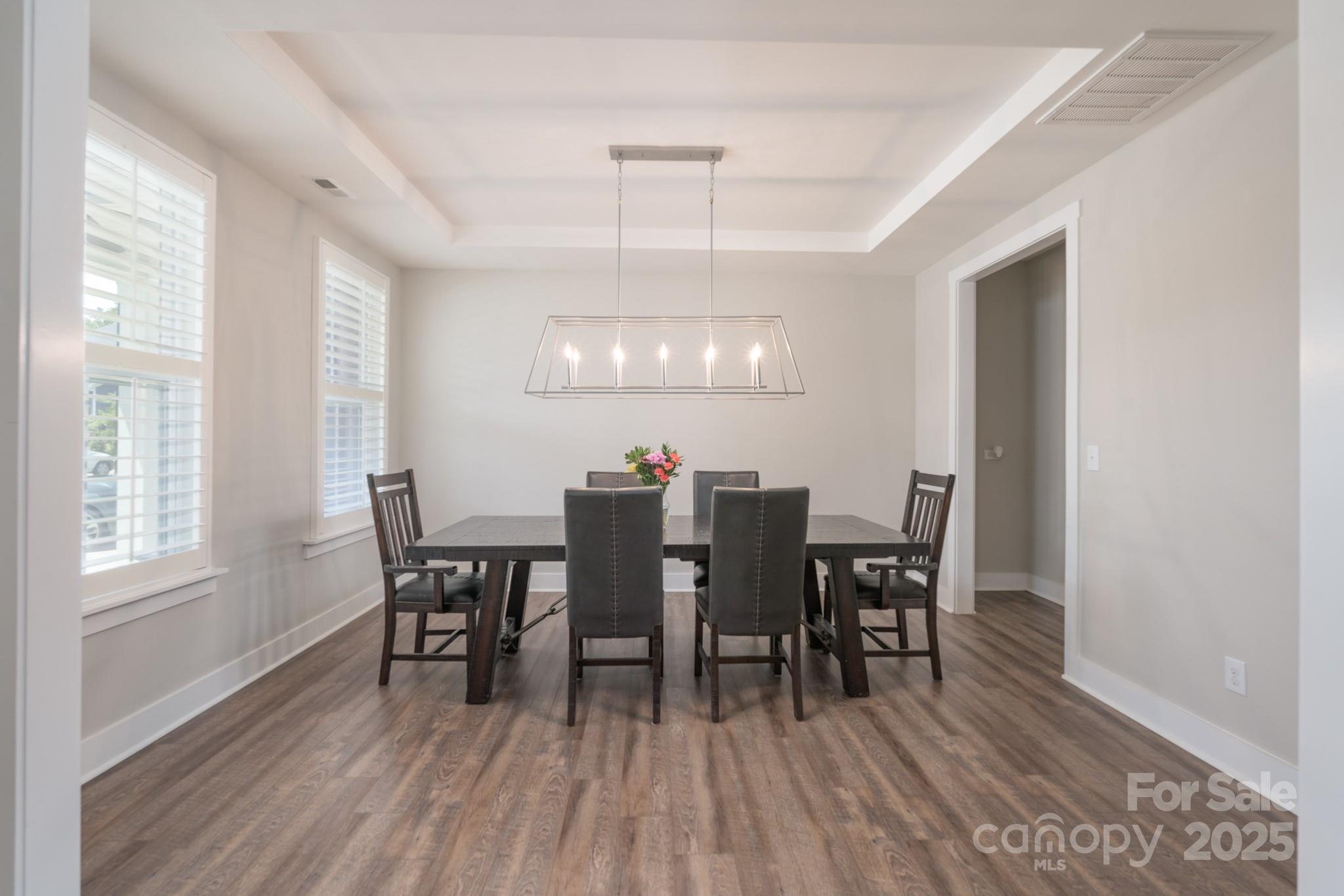 1180 Weir Court Fort Mill, SC 29708 - Photo 5 of 37 a view of a dining room with furniture window and wooden floor