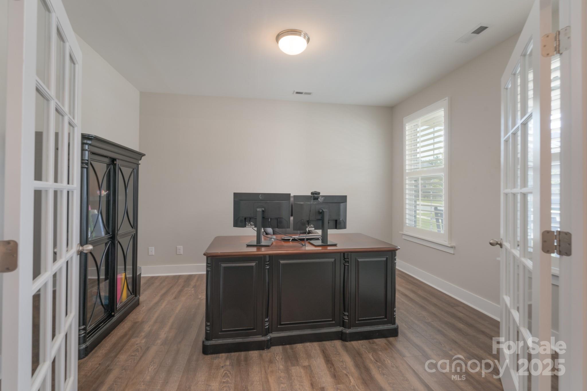 1180 Weir Court Fort Mill, SC 29708 - Photo 6 of 37 a room with furniture a window and wooden floor