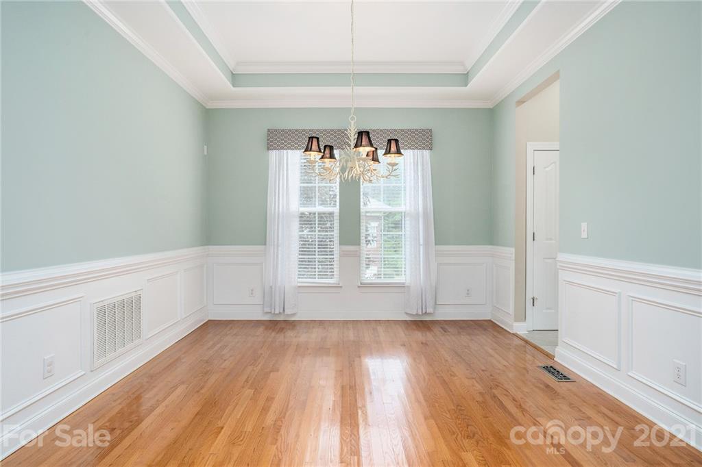 1416 Shade Tree Court Matthews, NC 28104 - Photo 11 of 22 wooden floor in an empty room with a window