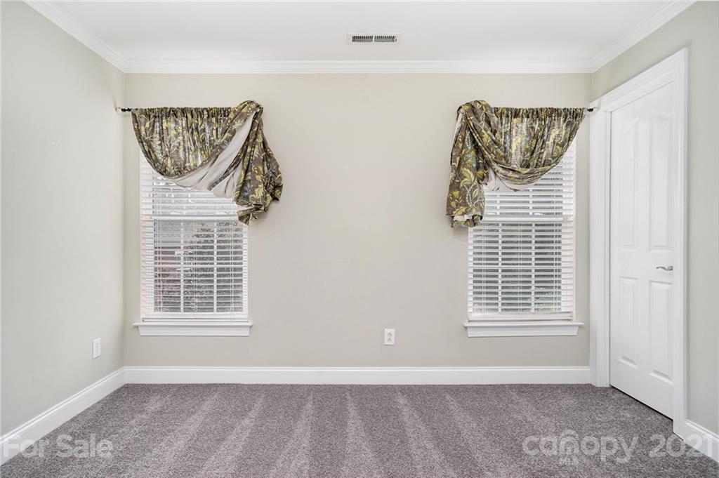 1416 Shade Tree Court Matthews, NC 28104 - Photo 13 of 22 a view of a windows and a chandelier in a room
