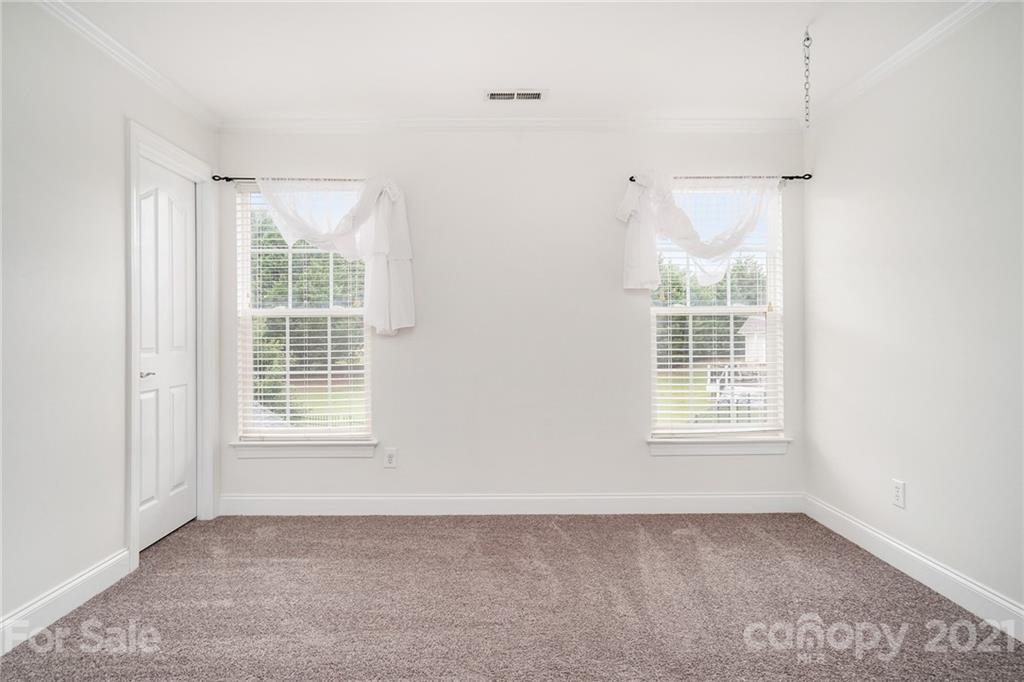 1416 Shade Tree Court Matthews, NC 28104 - Photo 14 of 22 an empty room with windows