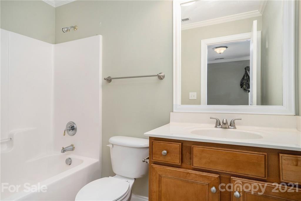 1416 Shade Tree Court Matthews, NC 28104 - Photo 17 of 22 a bathroom with a sink toilet and shower
