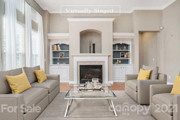 1416 Shade Tree Court Matthews, NC 28104 - Photo 2 of 22 a living room with furniture and a fireplace