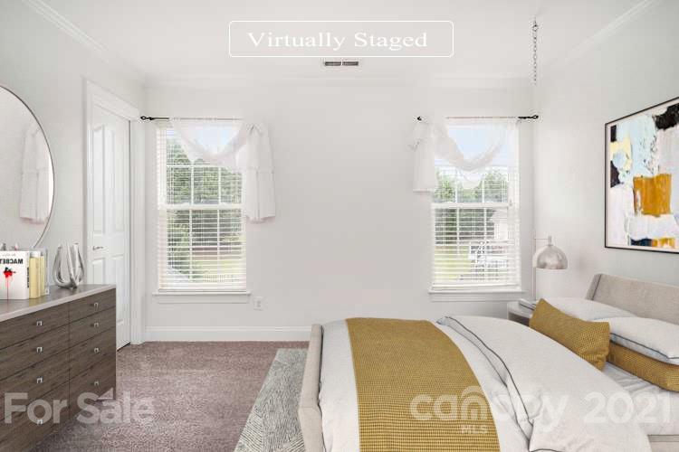 1416 Shade Tree Court Matthews, NC 28104 - Photo 3 of 22 a spacious bedroom with a bed and a window