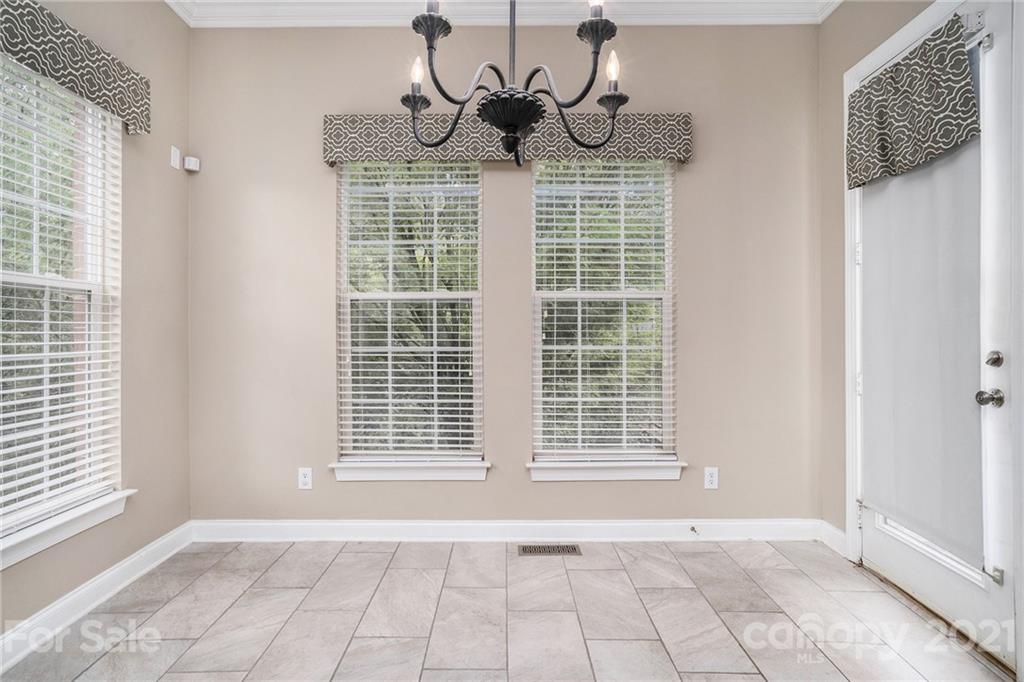 1416 Shade Tree Court Matthews, NC 28104 - Photo 9 of 22 a view of an empty room with a window