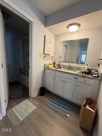 a kitchen with sink and cabinets