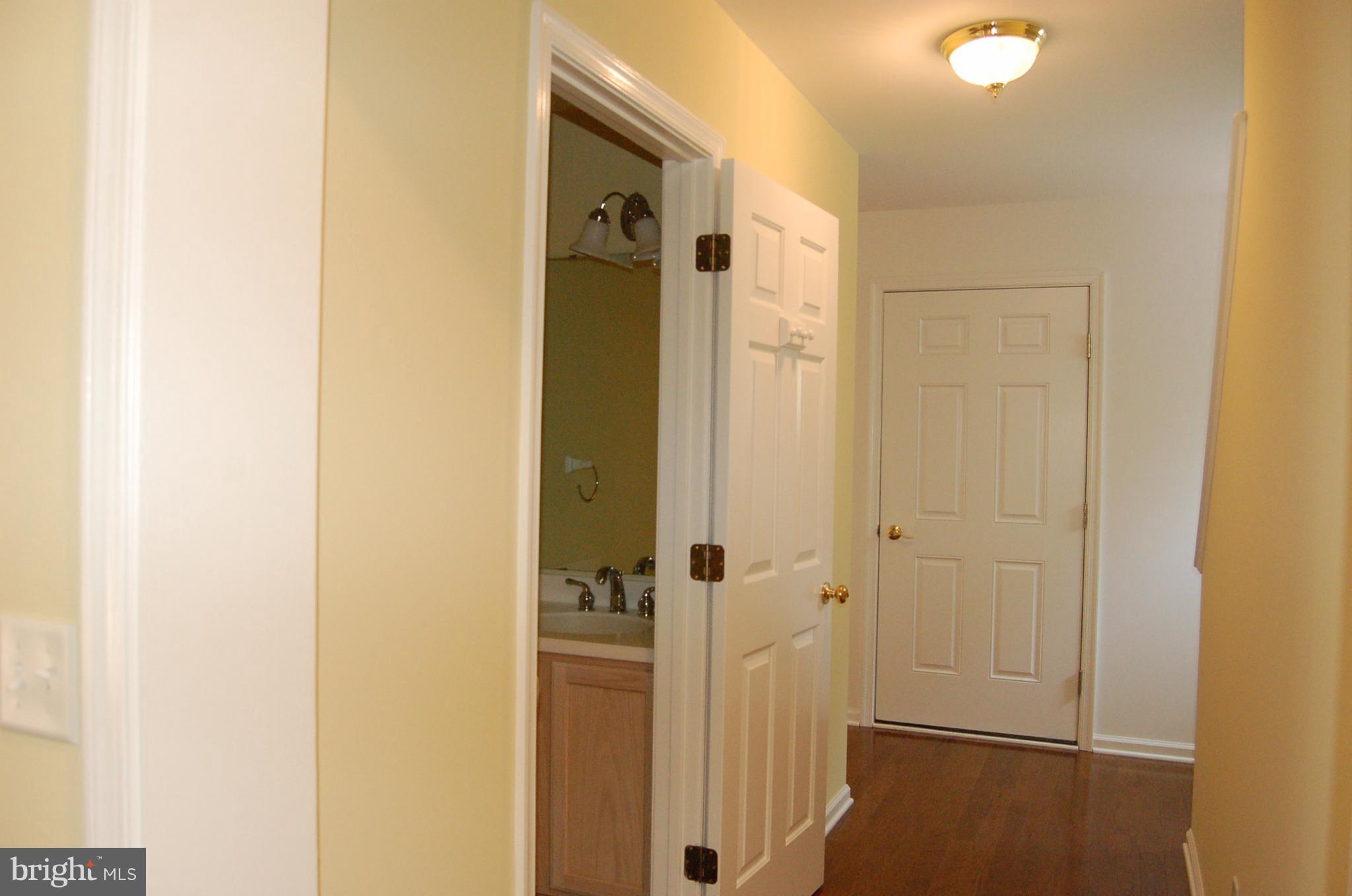 7414 Station Road Newcomb, MD 21653 - Photo 5 of 30 Foyer with powder room
