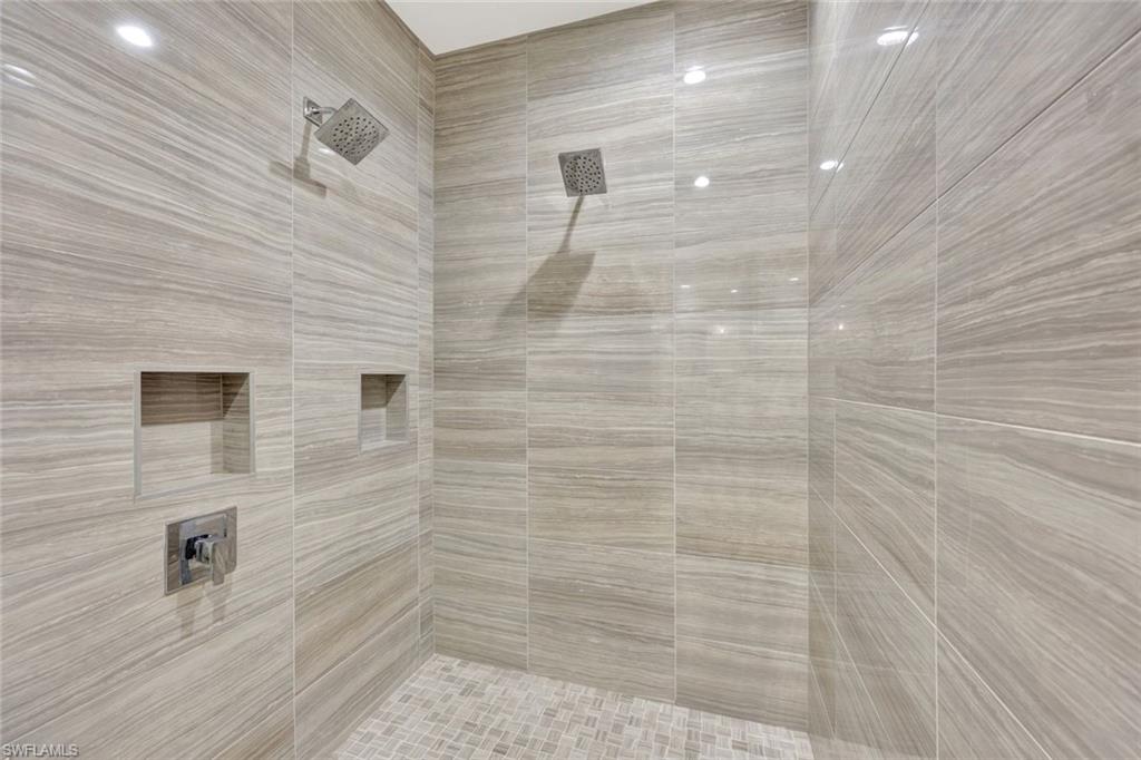 16350 Corsica Way, Unit 202 Naples, FL 34110 - Photo 17 of 39 a bathroom with a shower