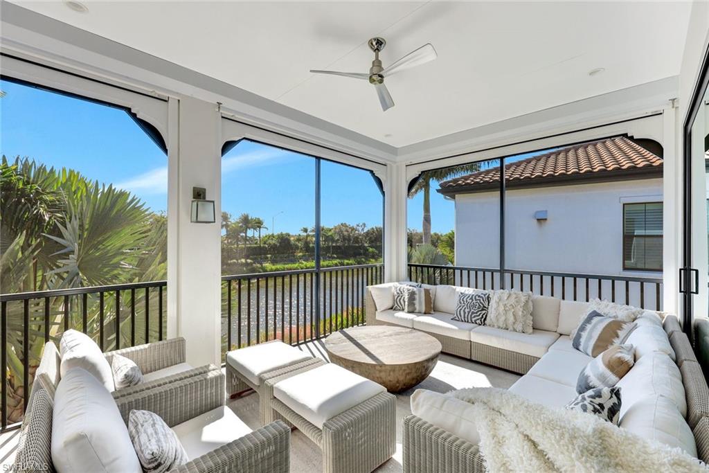 16350 Corsica Way, Unit 202 Naples, FL 34110 - Photo 29 of 39 a living room with furniture and a large window