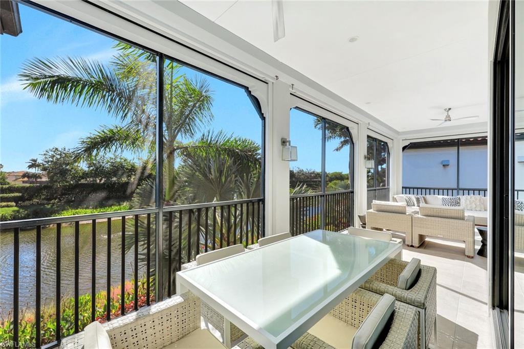 16350 Corsica Way, Unit 202 Naples, FL 34110 - Photo 30 of 39 a view of balcony with furniture and garden