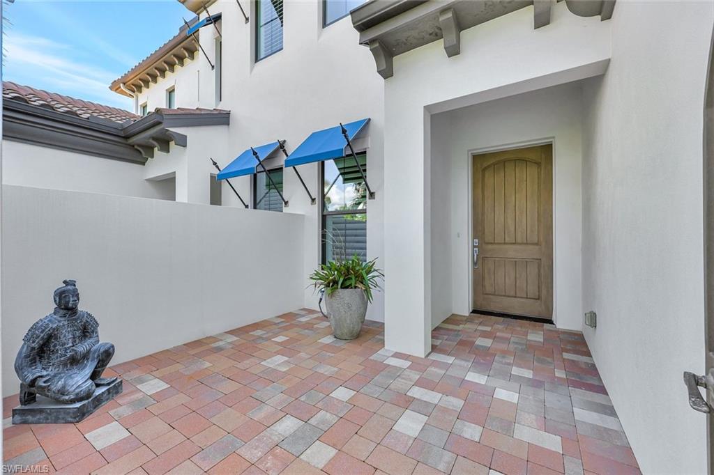 16350 Corsica Way, Unit 202 Naples, FL 34110 - Photo 36 of 39 a view of entryway with a front door