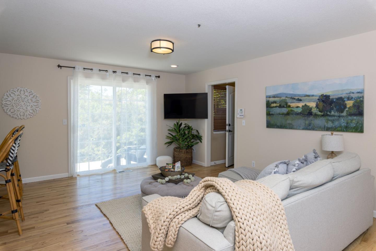 123 Reed Way Santa Cruz, CA 95060 - Photo 12 of 39 a living room with furniture and a flat screen tv