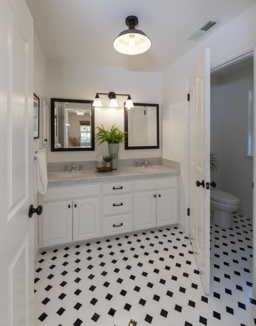 123 Reed Way Santa Cruz, CA 95060 - Photo 22 of 39 a bathroom with a granite countertop sink and a mirror