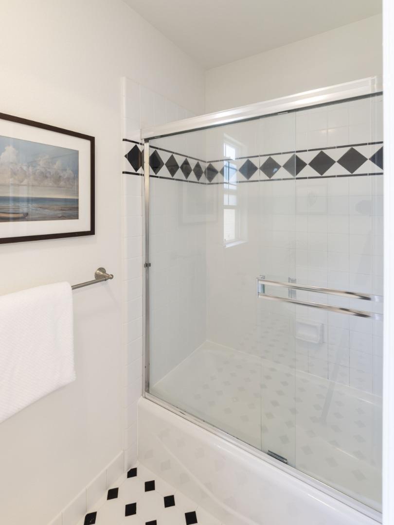 123 Reed Way Santa Cruz, CA 95060 - Photo 23 of 39 a bathroom with a shower and a glass door