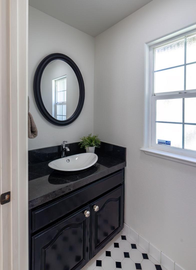 123 Reed Way Santa Cruz, CA 95060 - Photo 24 of 39 a bathroom with a sink and a mirror