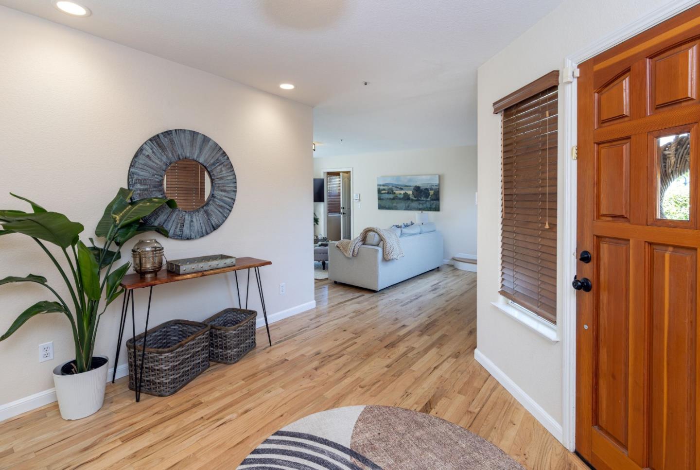 123 Reed Way Santa Cruz, CA 95060 - Photo 4 of 39 a bedroom with furniture and a potted plant