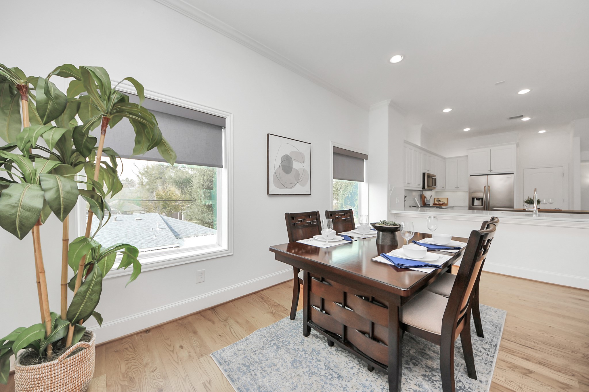 1628 West 24th Street Houston, TX 77008 - Photo 40 of 40 This inviting open floor plan offers ample space for a 6 to 8 person dining table, perfect for entertaining and creating memories.