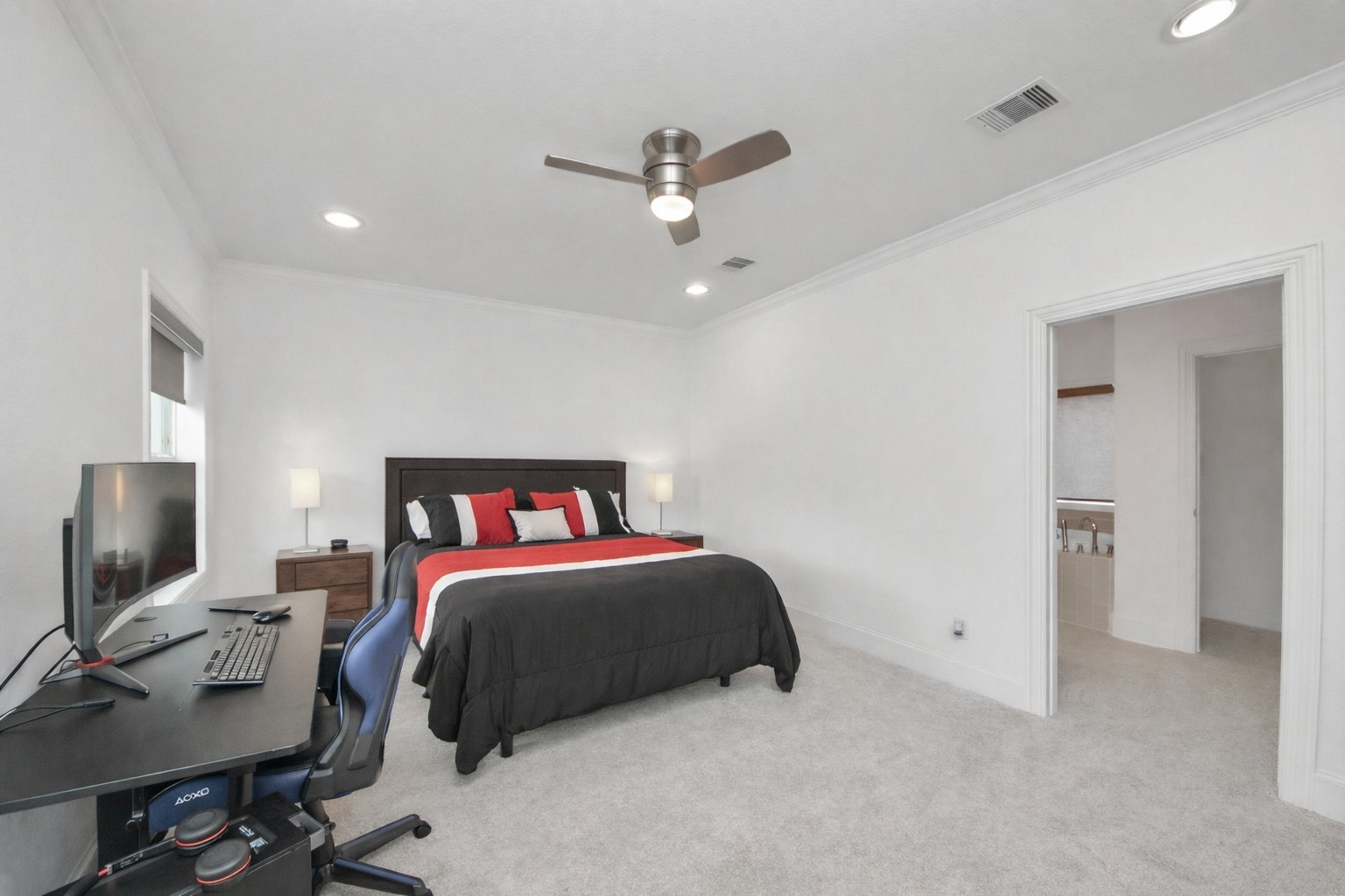 1628 West 24th Street Houston, TX 77008 - Photo 23 of 40 Discover ultimate comfort in this spacious primary bedroom, featuring a walk-in closet and a luxurious ensuite bathroom for a perfect retreat. New carpet installed in December 2025!