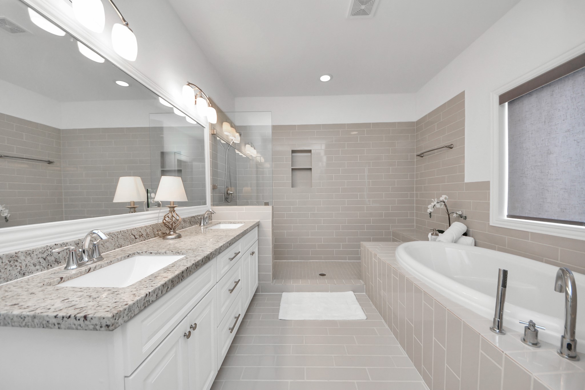 1628 West 24th Street Houston, TX 77008 - Photo 25 of 40 Discover the perfect blend of space and light in this bright, airy primary bathroom oasis.