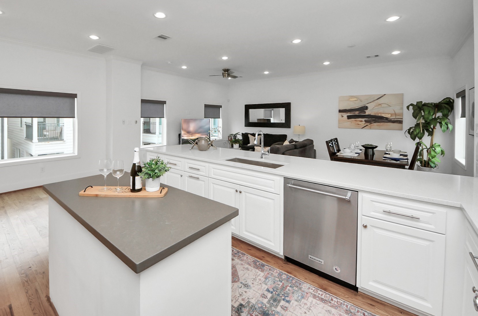 1628 West 24th Street Houston, TX 77008 - Photo 5 of 40 This home is an entertainer's dream with soaring ceilings and a seamless open concept connecting the kitchen, living, and dining areas.