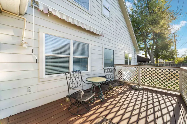 a view of a patio with a table and chairs