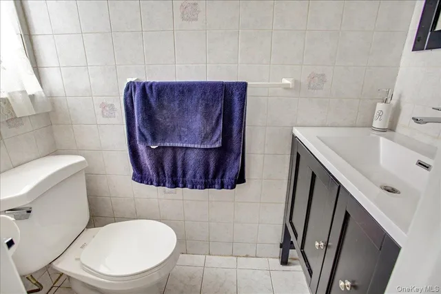 a bathroom with a toilet and a sink