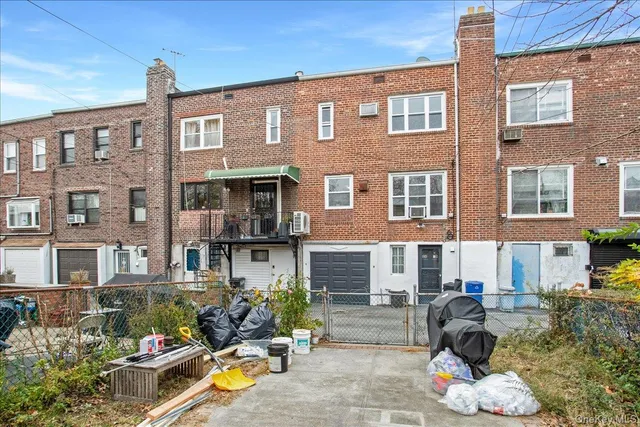 a front view of a building with outdoor space