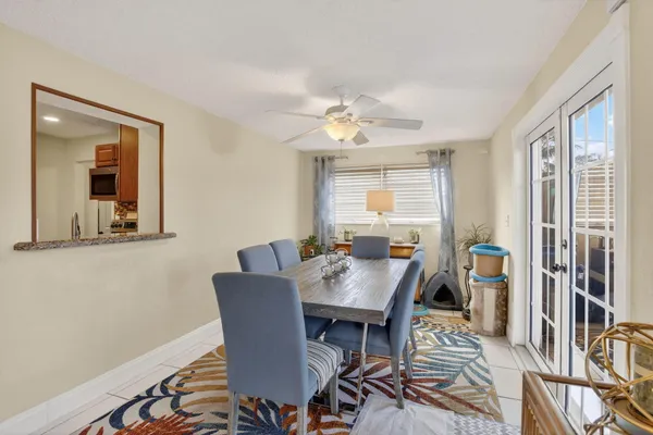 a living room with furniture a window and a chandelier