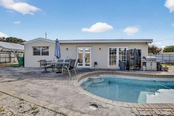 a view of a swimming pool with a patio