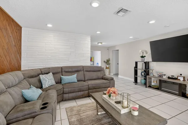 a living room with furniture and a window