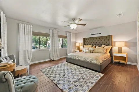 a bedroom with a large bed and a couch