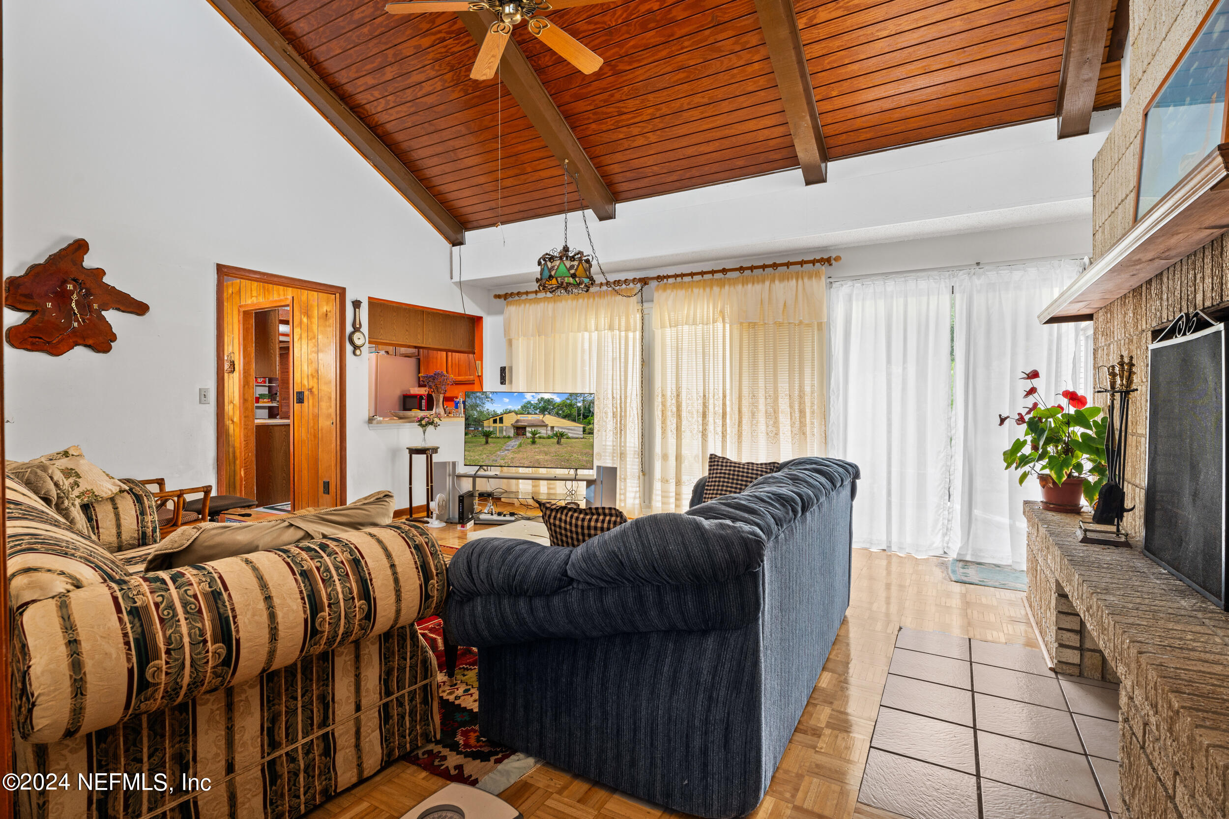 8080 Ibach Road Jacksonville, FL 32216 - Photo 17 of 34 a bed room with a bed and a couch