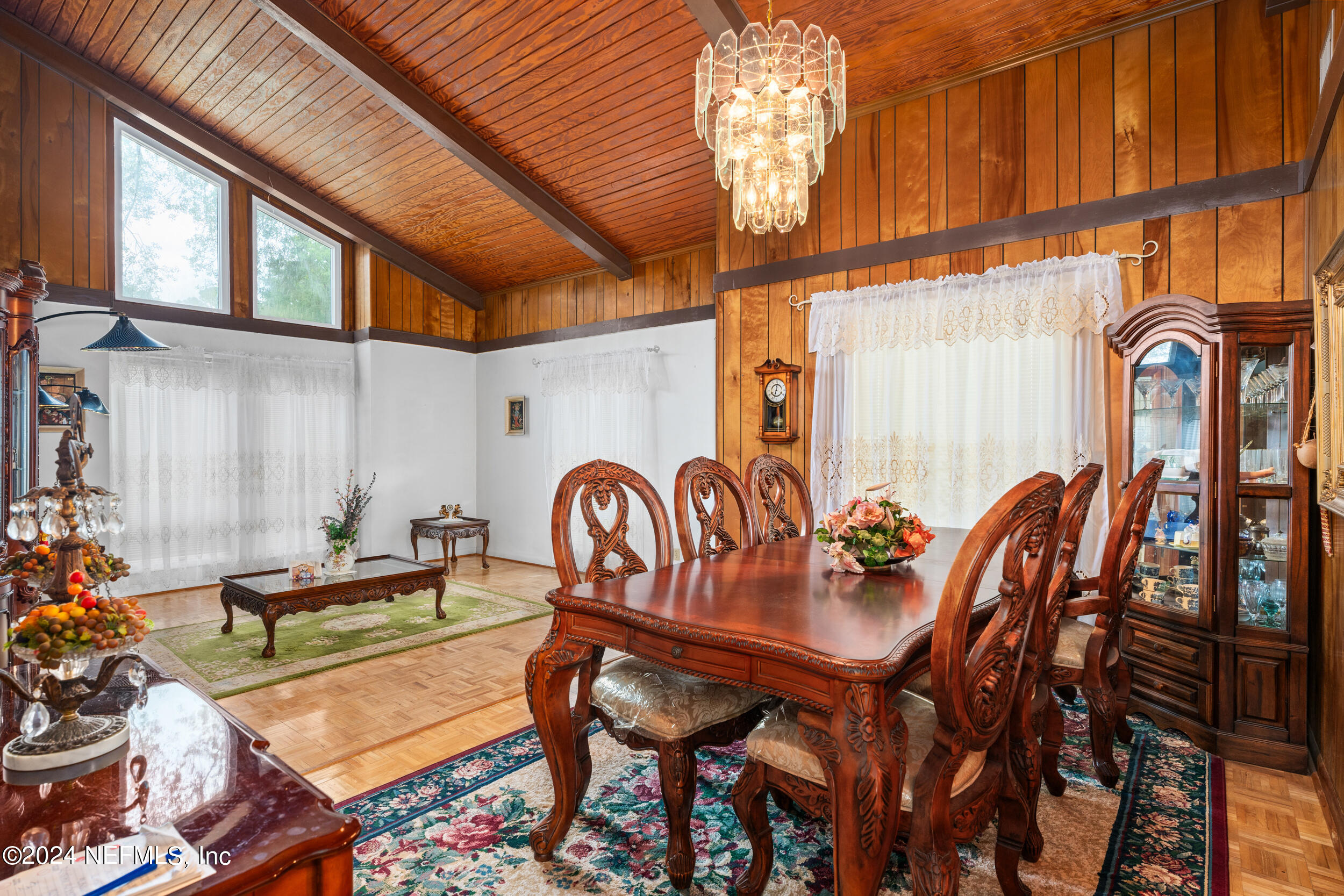 8080 Ibach Road Jacksonville, FL 32216 - Photo 19 of 34 a view of a dining room with furniture and chandelier