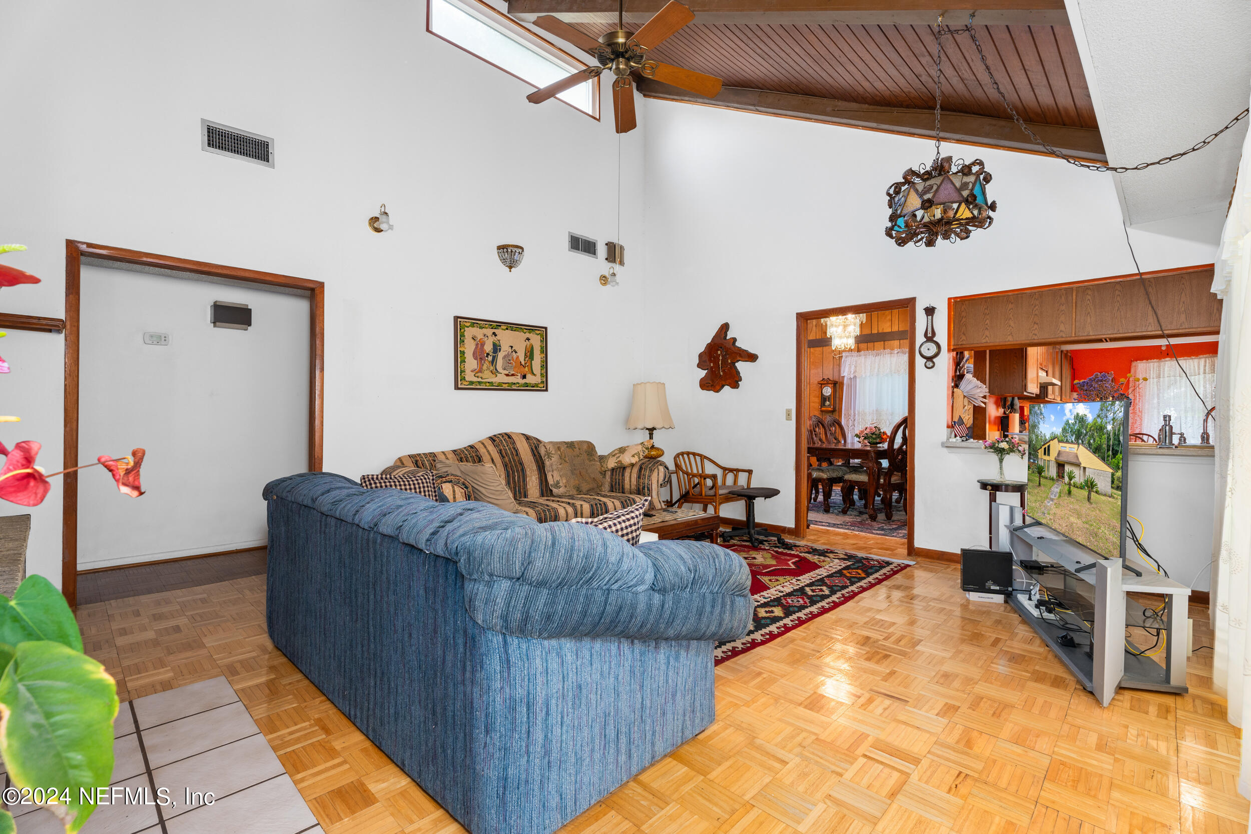 8080 Ibach Road Jacksonville, FL 32216 - Photo 20 of 34 a living room with furniture and a flat screen tv