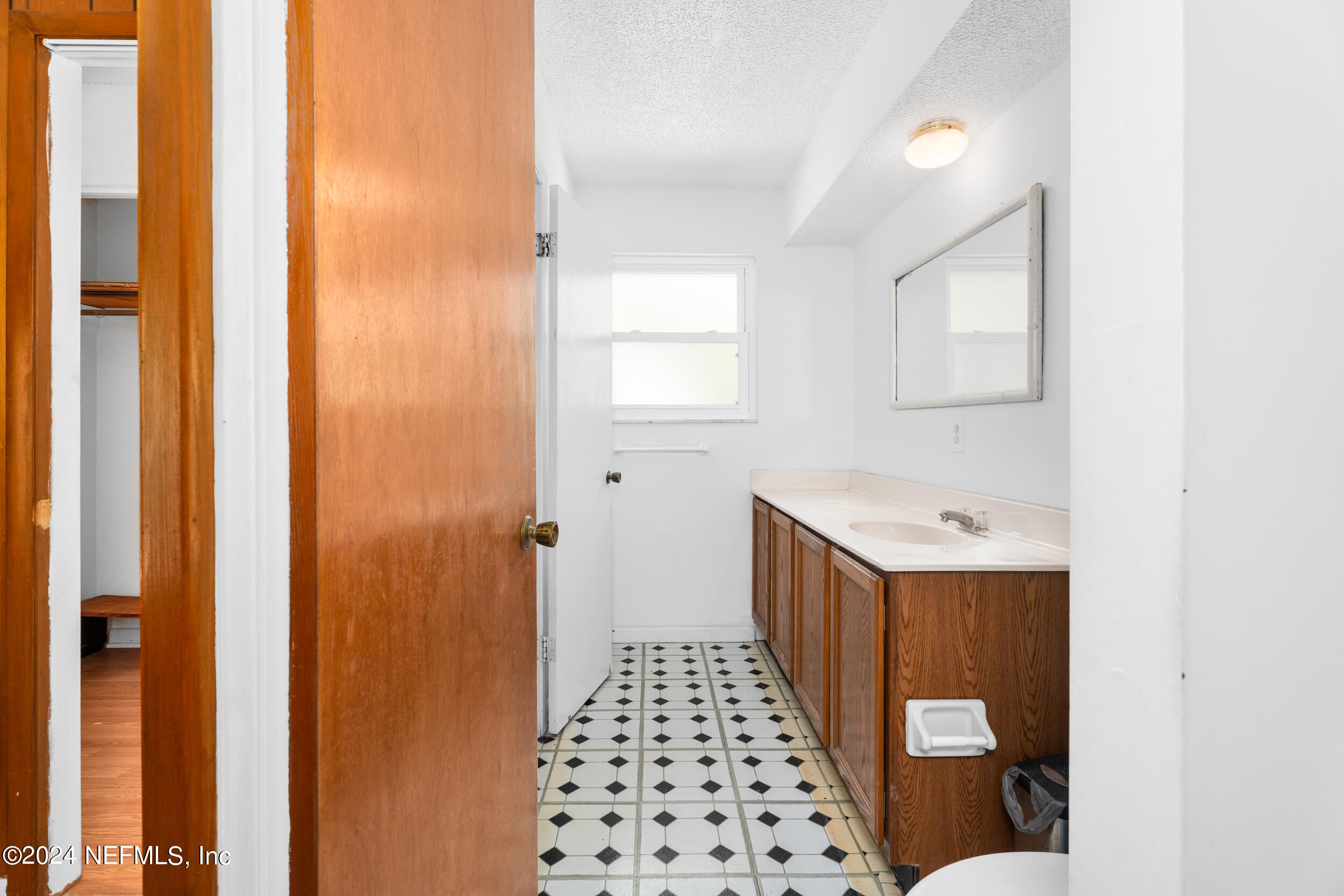 8080 Ibach Road Jacksonville, FL 32216 - Photo 27 of 34 a bathroom with a sink and a shower